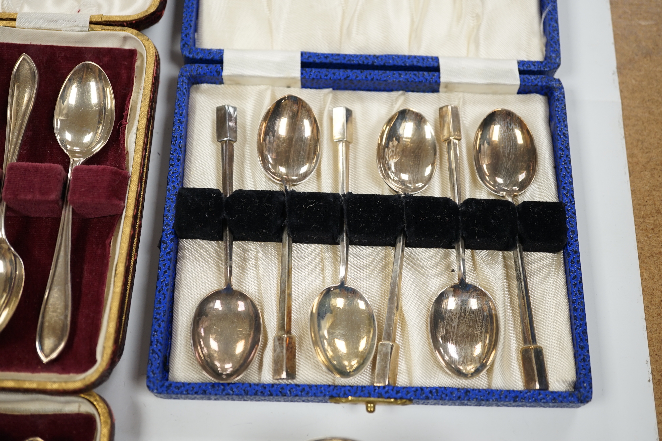 A pair of George V silver rat tail trefid spoons, Goldsmiths & Silversmiths Co Ltd, London, 1911, 20.2cm, three cased sets of silver coffee spoons and other silver flatware